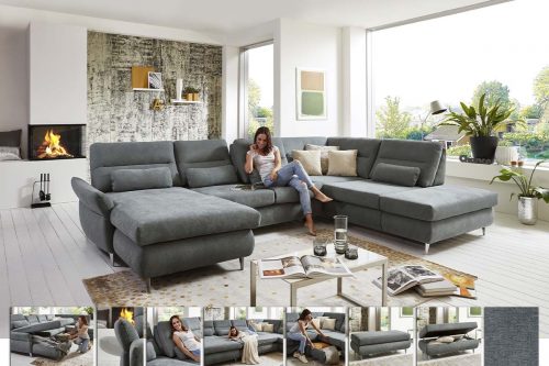 Sofa in U-Form in grauem Stoff mit Kimme im Rücken und Nierenkissen