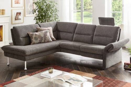Dunkelgraues Sofa mit Einzug im Rücken und runden Chromfüßen