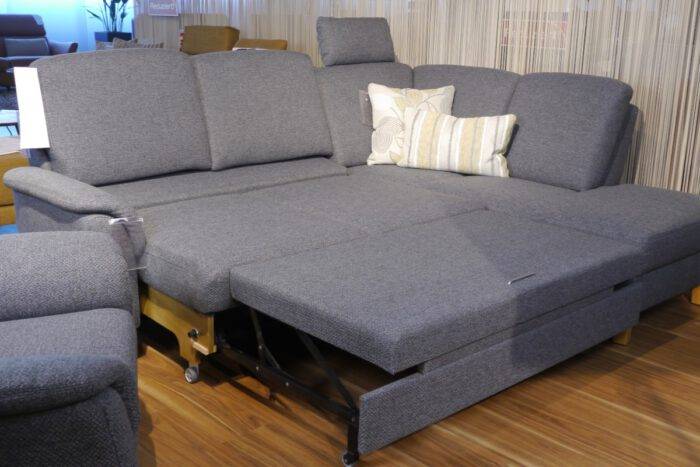 Ecksofa in dunkelgrau mit Bett